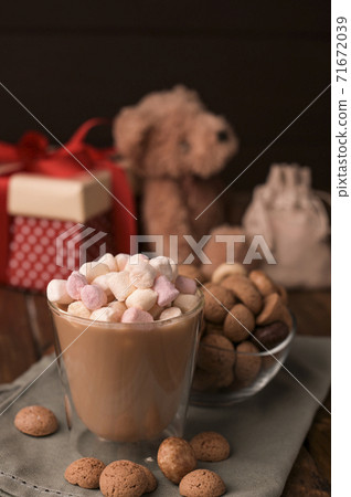Cocoa and Traditional sweets, cookies pepernoten on a wooden table. Copy space. Dutch holiday Cocoa and Traditional sweets, cookies pepernoten on a wooden table. Copy space. Dutch holiday 71672039