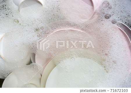 Washing dishes, Close up of utensils soaking in kitchen sink. Washing dishes, Close up of utensils soaking in kitchen sink. 71672103