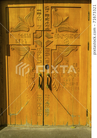 Double doors on the side of the facade of the Catholic Cathedral of the Holy Martyrs in Gyumri Double doors on the side of the facade of the Catholic Cathedral of the Holy Martyrs in Gyumri 71673321