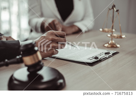 Attorneys or consultants who work in the courtroom are currently investigating the company's corruption cases and have their clients sign legal confirmation, Litigation and justice concept. 71675813