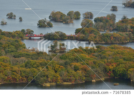 A freight train that runs through Onuma Park in autumn colors A freight train that runs through Onuma Park in autumn colors 71678385