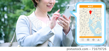 Image of a business woman using a map app on her smartphone 71679726