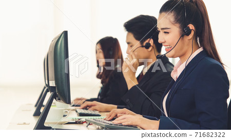 Business people wearing headset working in office Business people wearing headset working in office 71682322