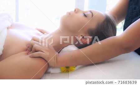 Woman gets shoulder massage spa by therapist. Woman gets shoulder massage spa by therapist. 71683639