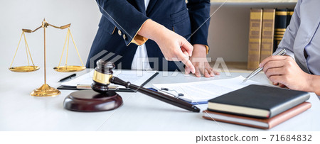 Consultation and conference of female lawyers and professional businesswoman working and discussion having at law firm in office. Concepts of law, Judge gavel with scales of justice Consultation and conference of female lawyers and professional businesswoman working and discussion having at law firm in office. Concepts of law, Judge gavel with scales of justice 71684832