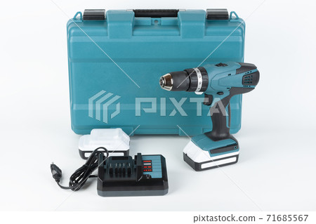 Cordless hammer screwdriver drill, battery charger and second battery and  carry case on white background. Studio shoot. 71685567