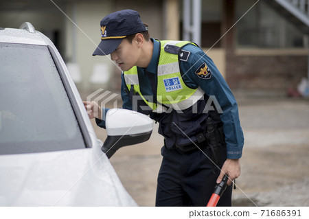 Asian male and female two police officers 123 71686391
