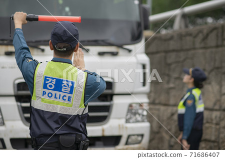 Asian male and female two police officers 137 71686407