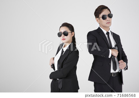 Asian male and female two security guards 080 Asian male and female two security guards 080 71686568