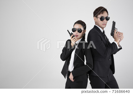 Asian male and female two security guards 123 Asian male and female two security guards 123 71686640