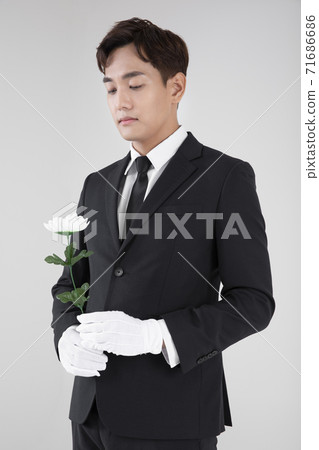 Cremation, people and mourning concept with flowers 022 71686686