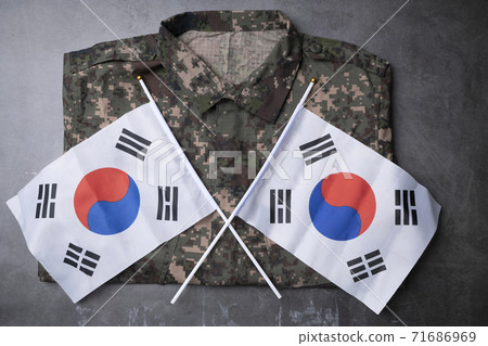 Military symbols concep, South Korean flag and folded military uniform 02 71686969