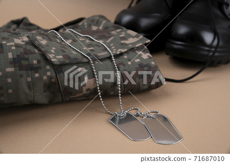 Military symbols concep, South Korean flag and folded military uniform 34 Military symbols concep, South Korean flag and folded military uniform 34 71687010