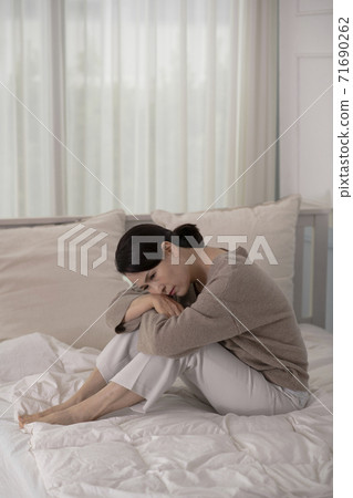 female disease concept, middle aged woman feeling pain 020 71690262