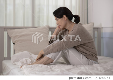 female disease concept, middle aged woman feeling pain 019 71690264