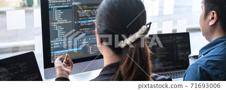 Professional Developer programmer cooperation meeting and brainstorming and programming in website working a software outsourcing and coding technology, writing codes and database 71693006