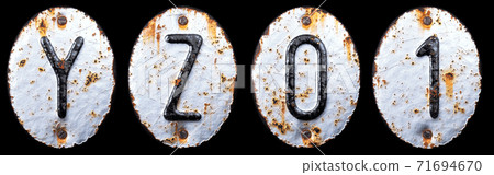 3D render set of capital letters Y, Z and number 0, 1 made of forged metal on the background fragment of a metal surface with cracked rust. 71694670