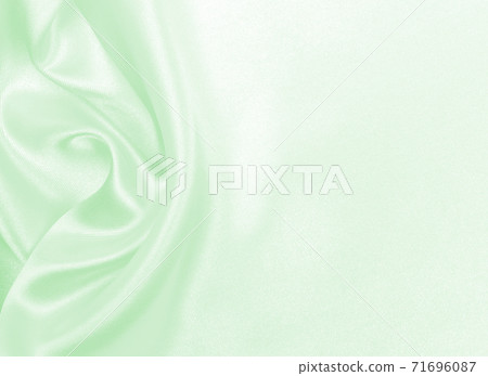 Smooth elegant green silk or satin luxury cloth texture as abstract background. Luxurious background design 71696087