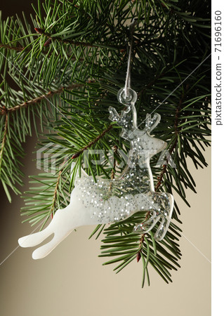 Pine branch with reindeer bauble, close up Pine branch with reindeer bauble, close up 71696160