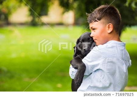 The boy with his favorite four-legged friend 71697025