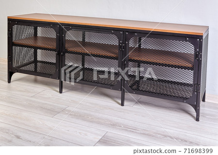Furniture with black metal frame is used as closed shoe rack or as a TV stand. 71698399