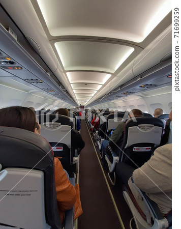 Passengers on the plane. 71699259