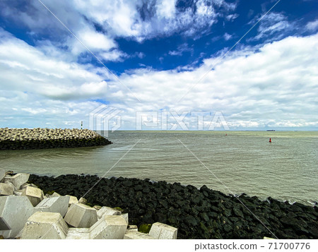 Pole at the entrance of the port in Cadzand, The Netherlands 71700776