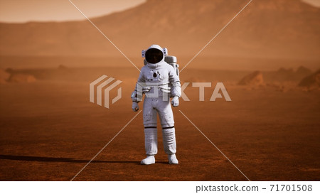 Astronaut on Mars Surface. Red Planet Covered in Gas and rock 71701508