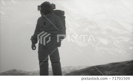 astronaut on another planet with dust and fog astronaut on another planet with dust and fog 71701509
