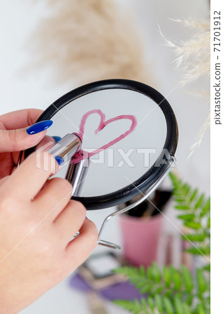 Different item for Beautiful makeup. Cosmetic, mirror and flower 71701912