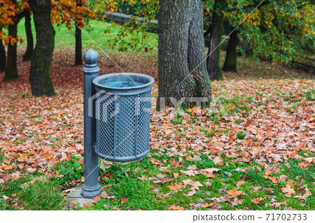 trash can in autumn park 71702733