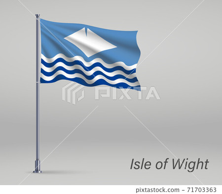 Waving flag of Isle of Wight - county of England on flagpole. Te 71703363