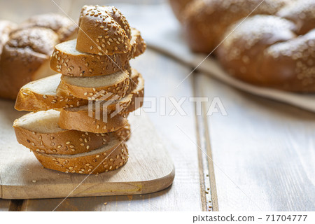 Traditional Jewish sweet Challah bread sliced. Traditional Jewish sweet Challah bread sliced. 71704777
