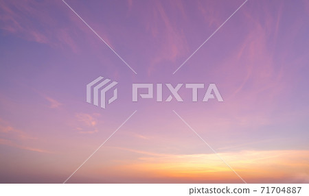 Abstract nature background. Dramatic blue sky with orange colorful sunset clouds in twilight time. 71704887
