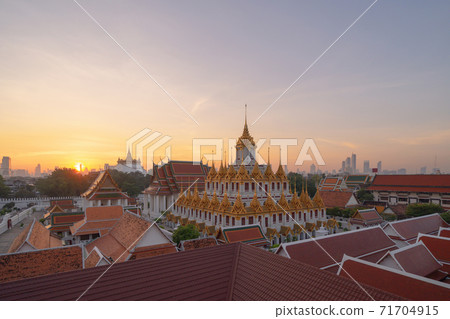 Loha Prasat Wat Ratchanatda and Golden Mountain pagoda, a buddhist temple or Wat Saket with skyscraper buildings in Bangkok Downtown, urban city, Thailand. Thai Landmark. Architecture. 71704915
