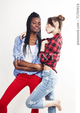 diverse multi nation girls, teenage friends cheerful having fun, happy smiling, cute posing isolated on white background, lifestyle people concept, african-american and caucasian diverse multi nation girls, teenage friends cheerful having fun, happy smiling, cute posing isolated on white background, lifestyle people concept, african-american and caucasian 71704919