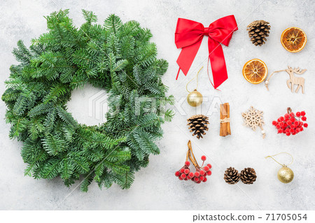 Handmade Christmas wreath on the white table Handmade Christmas wreath on the white table 71705054