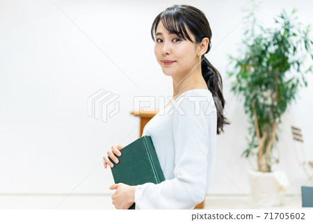 Woman with a book Reading image 71705602