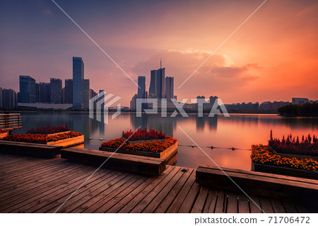 sunset over Swan Lake financial business district, Hefei city, China 71706472
