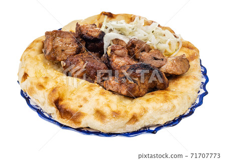 grilled kebab on flatbread on plate isolated grilled kebab on flatbread on plate isolated 71707773
