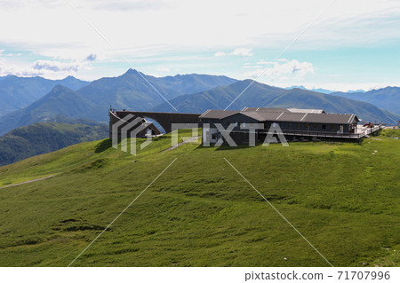 View of the Alp Foppa from the Monte Tamaro hiking trail in Ticino, Switzerland View of the Alp Foppa from the Monte Tamaro hiking trail in Ticino, Switzerland 71707996