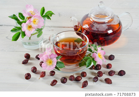 Teapot and cup of rose hip tea Teapot and cup of rose hip tea 71708873