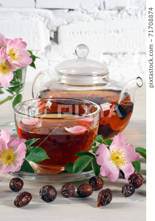 Cup and teapot tea with hip rose flowers Cup and teapot tea with hip rose flowers 71708874