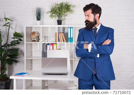 serious and mature boss at workplace. everything in order 71710072