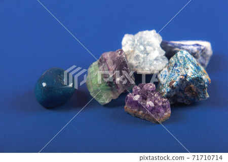 Natural minerals, precious stones on classic blue background 71710714