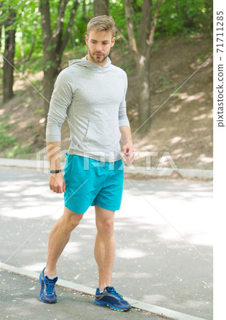 Fastest way to get in shape. Sportsman walk on sidewalk. Fastest way to get in shape. Sportsman walk on sidewalk. 71711285