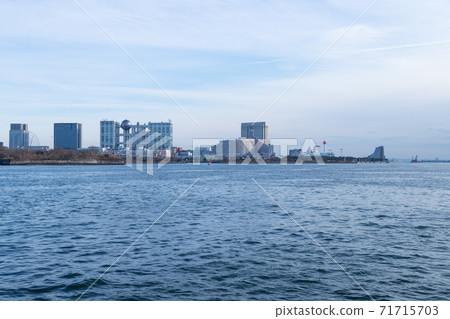Buildings in Odaiba seen from the Rainbow Bridge against the blue sky 71715703