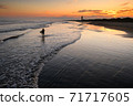 Kujukuri beach and surfers at dusk 71717605