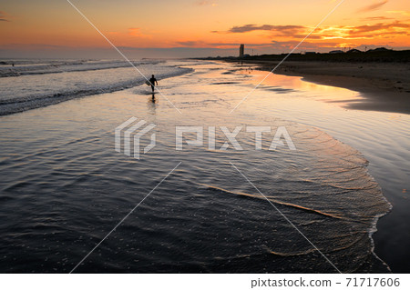 Kujukuri beach and surfers at dusk Kujukuri beach and surfers at dusk 71717606