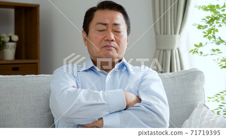 Middle-aged man thinking frowning Middle-aged man thinking frowning 71719395